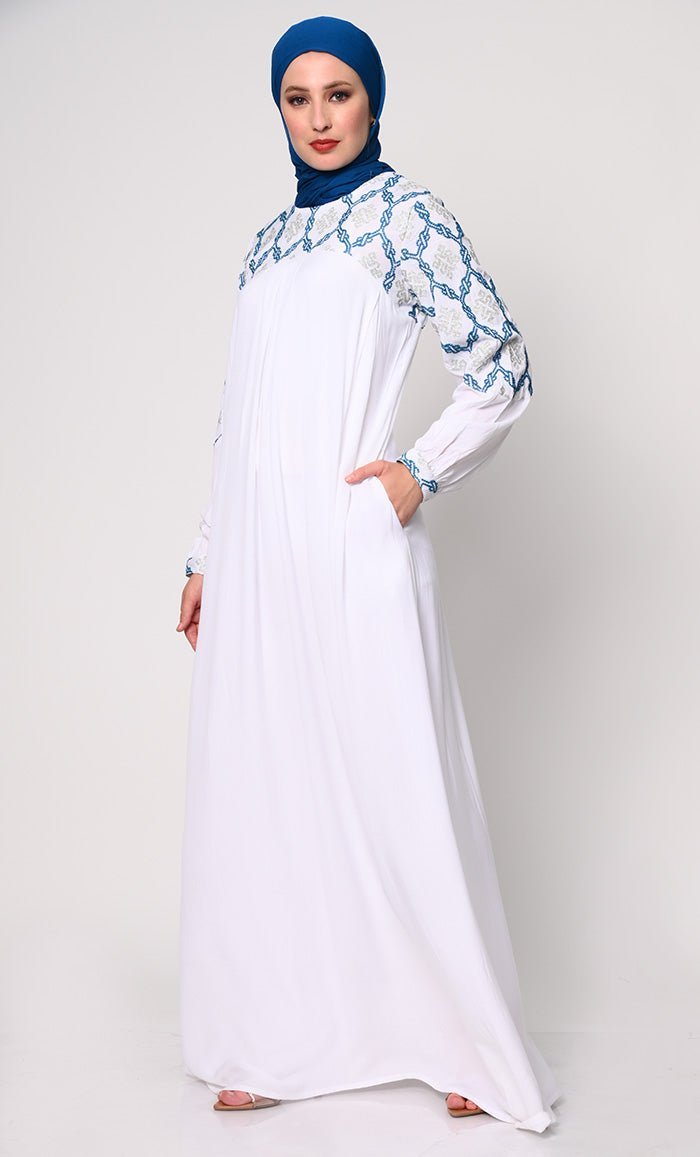 Elegant Simplicity: Embroidered White Abaya with Box Pleats and Dual Pockets - Final Sale - EastEssence.com