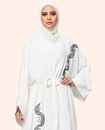 women wearing white wom abaya with black printed style 