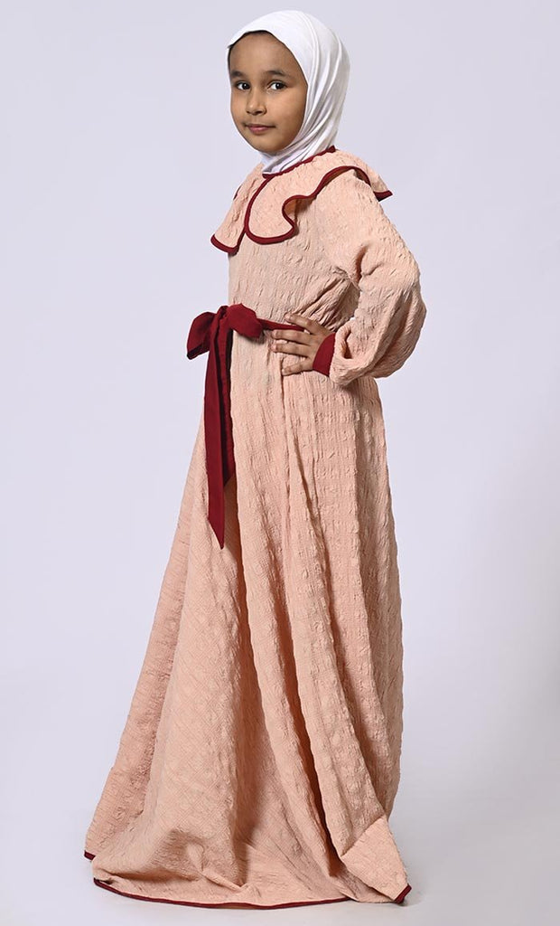 Chic Charm: Girls' Peach Abaya with Peter Pan Collar and Loose Belt - EastEssence.com