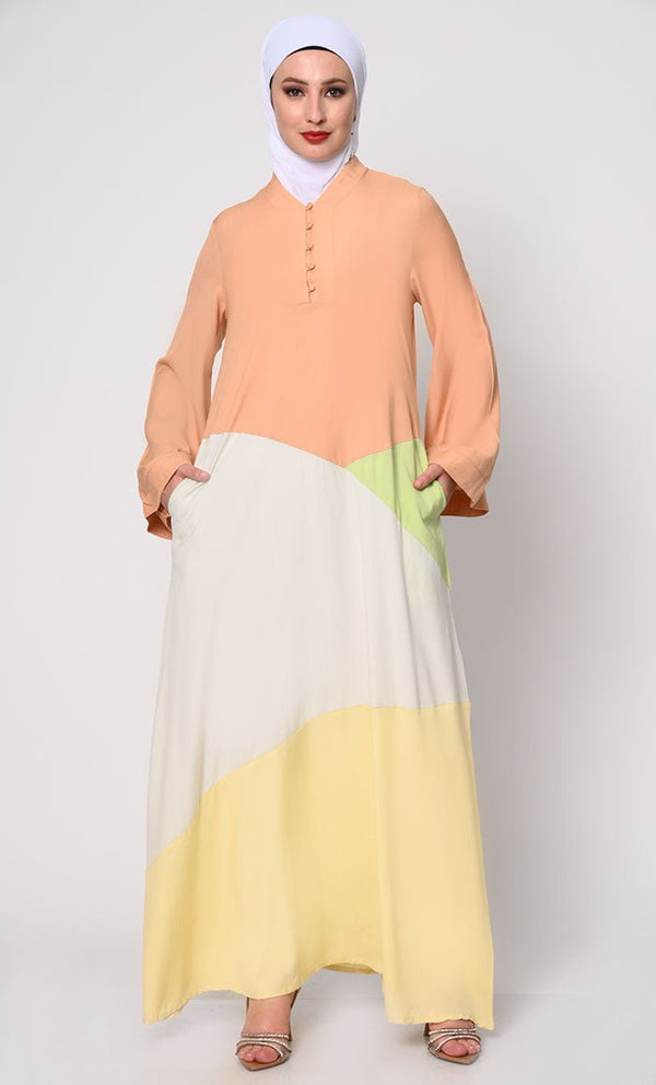 Contemporary Elegance: Abaya with Pastel Color - Blocking Panels and Practical Pockets - EastEssence.com