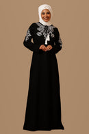 Abaya noire brodée Firdous avec liens à nouer et pompons