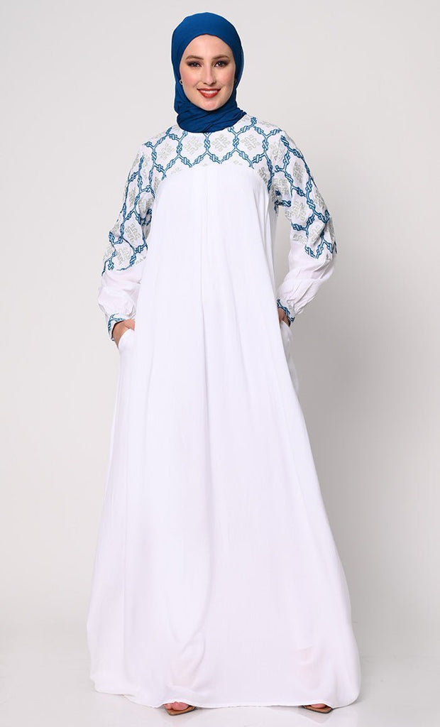 Elegant Simplicity: Embroidered White Abaya with Box Pleats and Dual Pockets - Final Sale - EastEssence.com