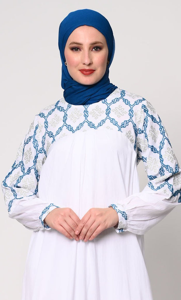 Elegant Simplicity: Embroidered White Abaya with Box Pleats and Dual Pockets - Final Sale - EastEssence.com