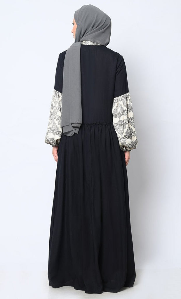 Mystic Bloom: Printed Black Abaya with Low Waist Gathers and Pockets - EastEssence.com