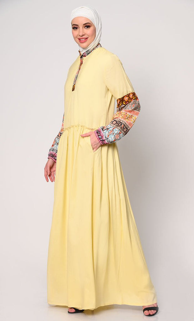 Mystic Bloom: Printed Yellow Abaya with Low Waist Gathers and Pockets - EastEssence.com