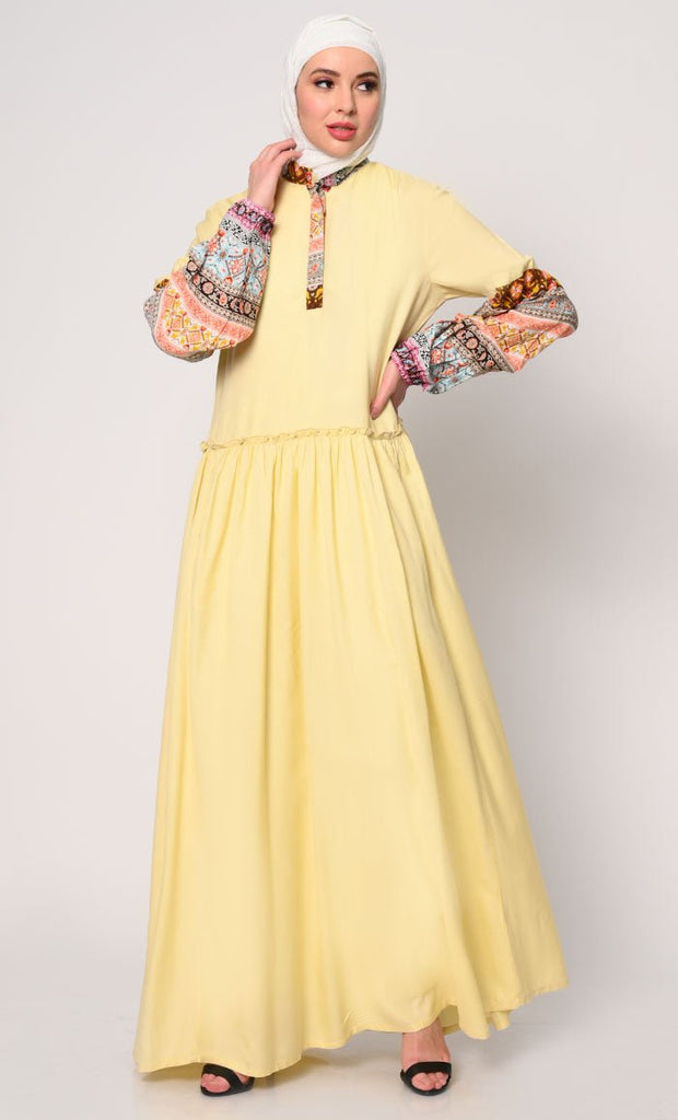 Mystic Bloom: Printed Yellow Abaya with Low Waist Gathers and Pockets - EastEssence.com