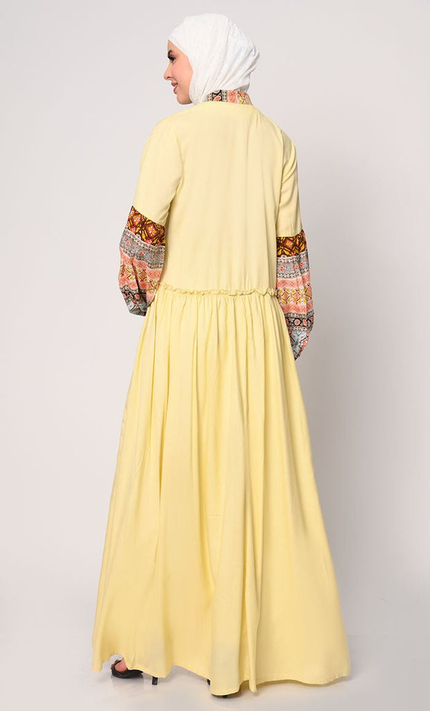 Mystic Bloom: Printed Yellow Abaya with Low Waist Gathers and Pockets - EastEssence.com