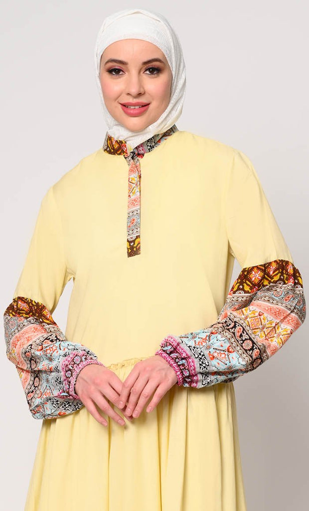 Mystic Bloom: Printed Yellow Abaya with Low Waist Gathers and Pockets - EastEssence.com