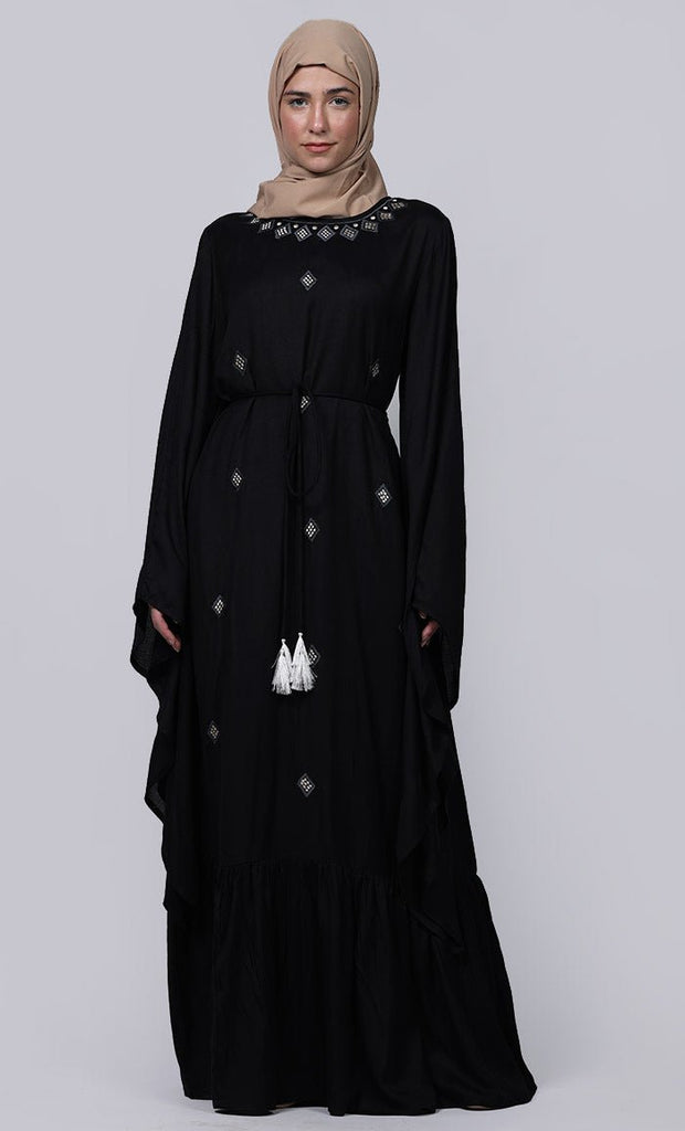 women wearing black abaya, white embroidery with loose belt
