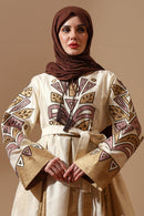 Regal Embroidered Silk Abaya in Ivory & Gold with Tribal Motif - EastEssence.com