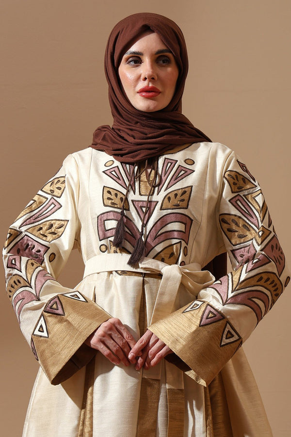 Regal Embroidered Silk Abaya in Ivory & Gold with Tribal Motif - EastEssence.com