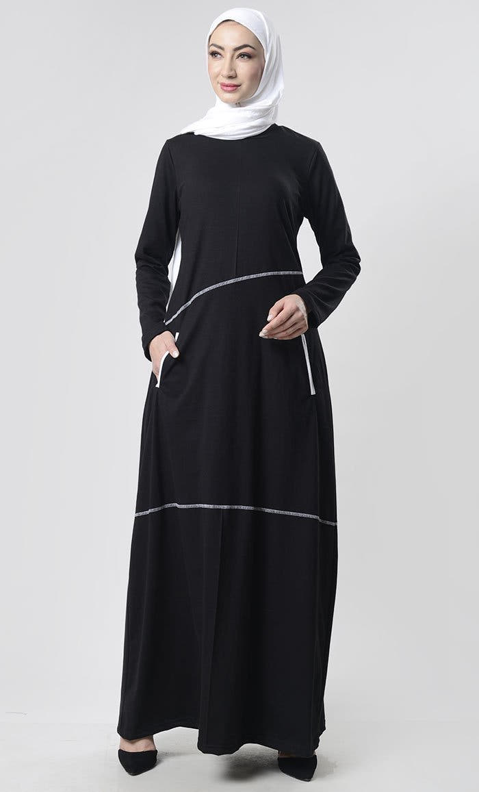 Abaya simple avec surpiqûres détaillées et poches